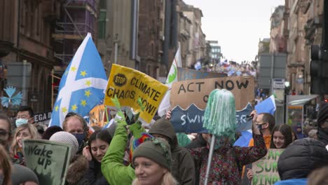 Handheld-Shot-of-Global-Warming-Protestors-Marching-Through-the-Streets-of-Glasgow