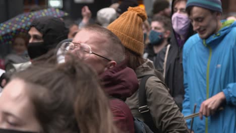 Handheld-Shot-of-Climate-Change-Protester-Shouting-into-Megaphone-During-Glasgow-Demonstrations