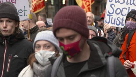Handheld-Shot-of-Climate-Change-Protestors-Marching-Through-Glasgow-Streets