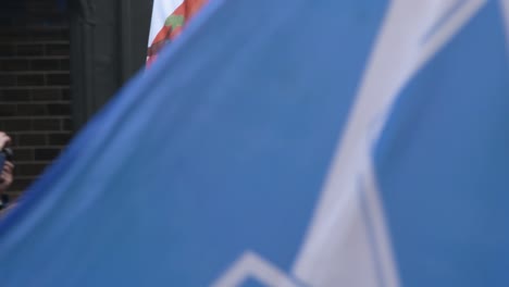 Handheld-Shot-of-'For-the-Foxes'-Sign-During-Climate-Change-Protests-In-Glasgow