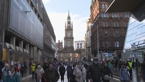 Handheld-Shot-of-Climate-Change-Demonstrators-Marching-Through-Streets-of-Glasgow