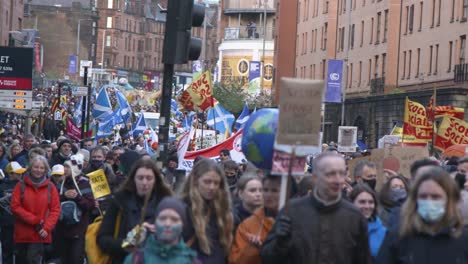 Handheld-Shot-of-Climate-Change-Protestors-Marching-Through-Glasgow-