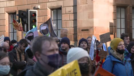 Handheld-Shot-of-Climate-Change-Protestors-Marching-Through-Glasgow
