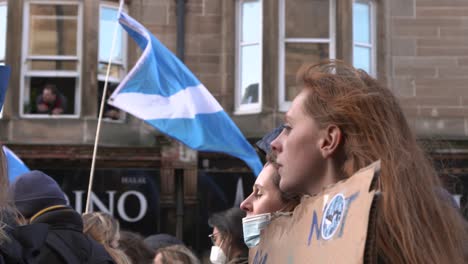 Handheld-Shot-of-Climate-Change-Protester-Holding-Sign-During-Rallies-In-Glasgow
