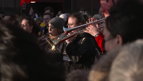 Handheld-Shot-of-Brass-Band-Playing-During-Climate-Change-Demonstrations-In-Glasgow