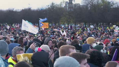 Handheld-Shot-of-Climate-Change-Activists-Gathered-On-Glasgow-Green
