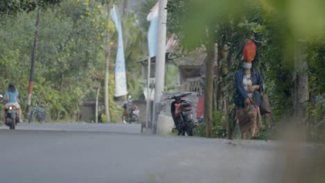 Long-Shot-of-Woman-and-Motorcycles-On-Road-in-Bali
