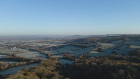 Drone-Shot-Rising-Over-Cotswold-Fields-On-Frosty-Morning