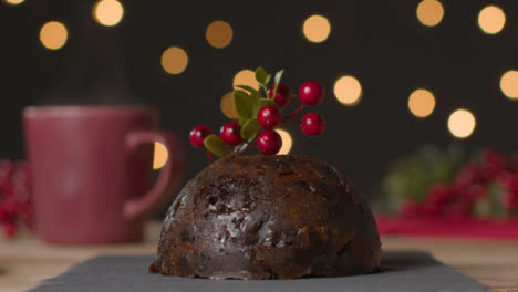Close-Up-Shot-of-Christmas-Pudding-and-Holly