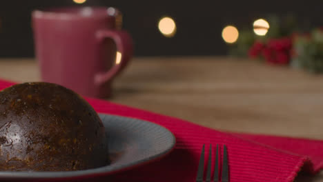 Tracking-Shot-Approaching-Christmas-Pudding-On-Plate