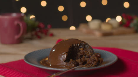 Tracking-Shot-Approaching-Broken-Chocolate-Covered-Christmas-Pudding