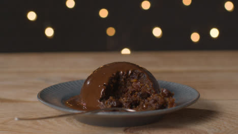 Tracking-Shot-Approaching-a-Broken-Chocolate-Covered-Christmas-Pudding