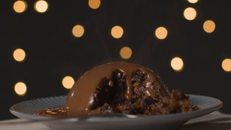 Close-Up-Shot-of-Rotating-Chocolate-Covered-Christmas-Pudding
