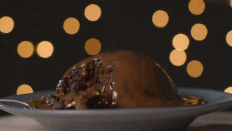 Close-Up-Shot-of-a-Rotating-Chocolate-Covered-Christmas-Pudding