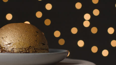 Close-Up-Shot-of-Rotating-Gold-Leaf-Christmas-Pudding