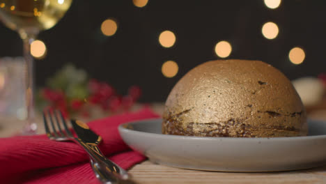 Sliding-Shot-of-Gold-Leaf-Christmas-Pudding-