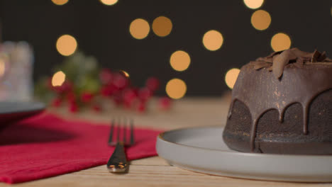 Sliding-Shot-of-Christmas-Cake-On-Table
