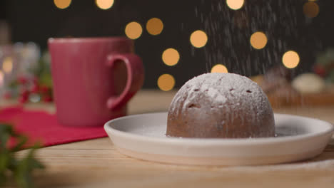 Tracking-Shot-Pulling-Away-from-Christmas-Pudding-On-a-Rustic-Table