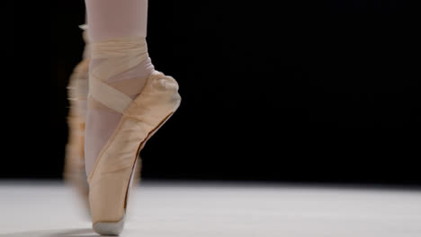 Close-Up-Shot-of-Ballet-Dancer-on-Pointe-Through-the-Frame
