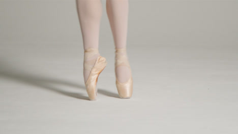 Close-Up-Shot-of-Ballet-Dancers-Feet-Dancing-on-Pointe