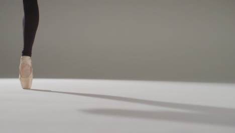 Low-Angle-Shot-of-Ballet-Dancers-Feet-Dancing