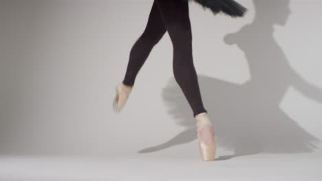 Low-Angle-Shot-of-Ballet-Dancers-Feet-on-Pointe