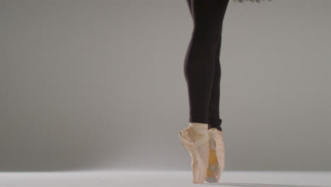 Low-Angle-Shot-of-a-Ballet-Dancer-Dancing-on-Pointe