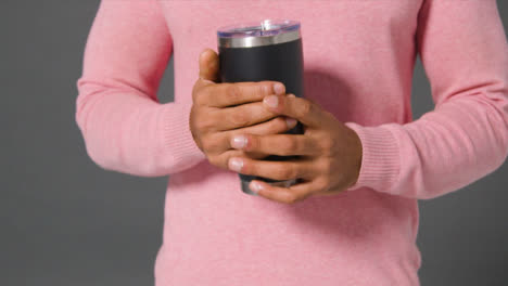 Close-Up-Shot-of-Man-Holding-and-Drinking-From-Flask