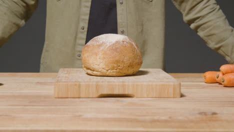 Tracking-Shot-of-Loaf-of-Bread-on-Kitchen-Workspace