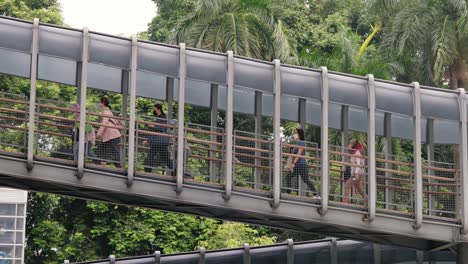 Tracking-Shot-of-Pedestrians-Walking-Up-Ramp-02