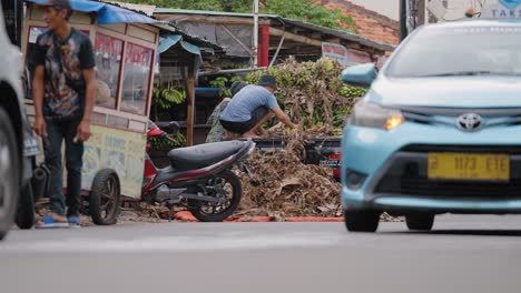 Low-Angle-Shot-of-Workers-Unloading-Bananas-from-Van