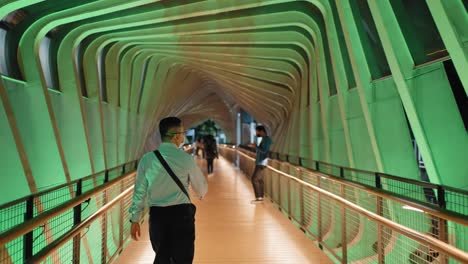 Tracking-Shot-Following-People-On-Jakartas-Colourful-Gelora-Bung-Karno-Footbridge