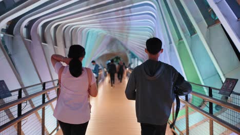 Tracking-Shot-Following-People-On-Colourful-Gelora-Bung-Karno-Footbridge
