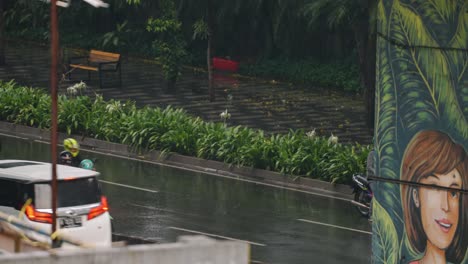 Long-Shot-of-Moped-Pulling-Out-into-Traffic-In-Rain