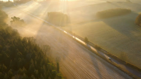 Drone-Shot-Flying-Over-Rural-Road-at-Sunrise