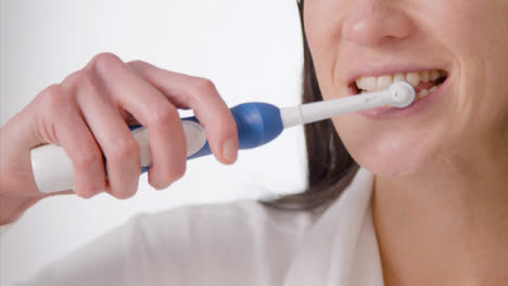 Close-Up-Shot-of-Woman-Brushing-Her-Teeth-