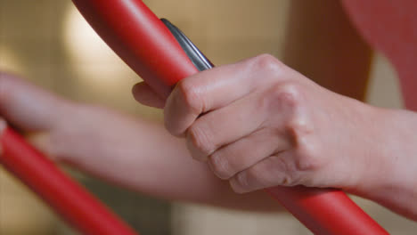 Tracking-Shot-of-Woman-Working-Out-on-a-Bike-at-Gym