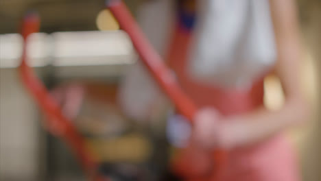 Defocused-Shot-of-Woman-Finishing-and-Getting-off-of-Bike