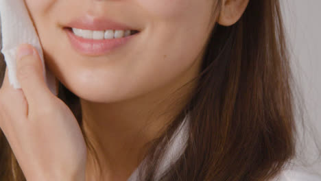 Close-Up-Shot-of-a-Woman-Taking-off-Makeup