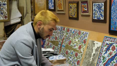 Mid-Shot-of-Man-Browsing-Tiles