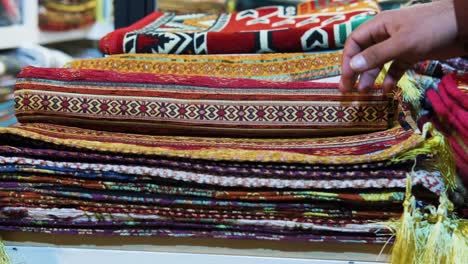 Close-Up-Shot-of-Man-Browsing-Rugs