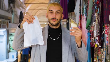 Mid-Shot-of-Man-Holding-Bag-and-Money