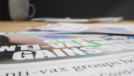 Close-Up-of-Omicron-Newspaper-Title-and-Anxi-vaxxers-01