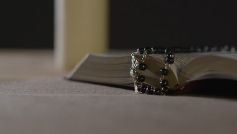 Tracking-Shot-of-Holy-Bible-and-a-Crucifix