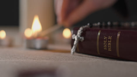 Close-Up-of-Candles-Being-Lit