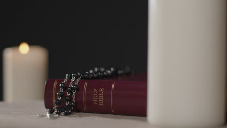 Close-Up-Shot-of-Bible-and-Crucifix