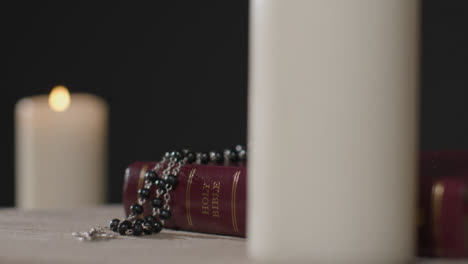 Close-Up-Shot-of-a-Bible-and-Crucifix