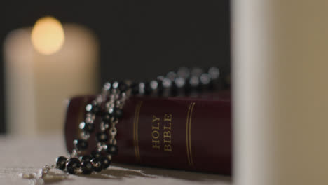 Close-Up-Shot-of-Bible-and-a-Crucifix