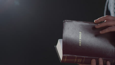 Mid-Shot-of-a-Man-Reading-a-Holy-Bible