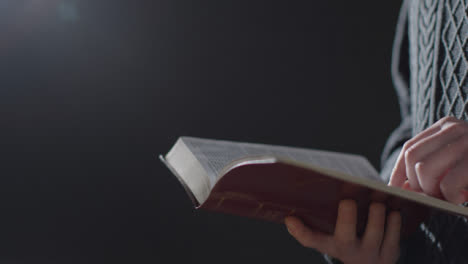 Mid-Shot-of-a-Man-Reading-Holy-Bible